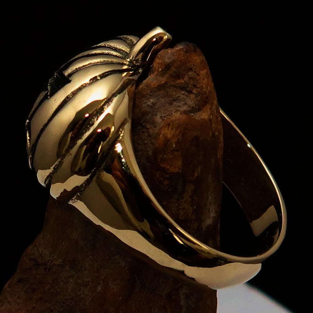 A beautifully crafted solid brass men's pumpkin ring with an antiqued and polished finish, showcasing intricate pumpkin design.