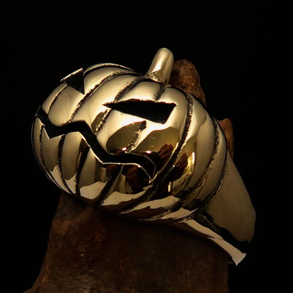 A beautifully crafted solid brass men's pumpkin ring with an antiqued and polished finish, showcasing intricate pumpkin design.