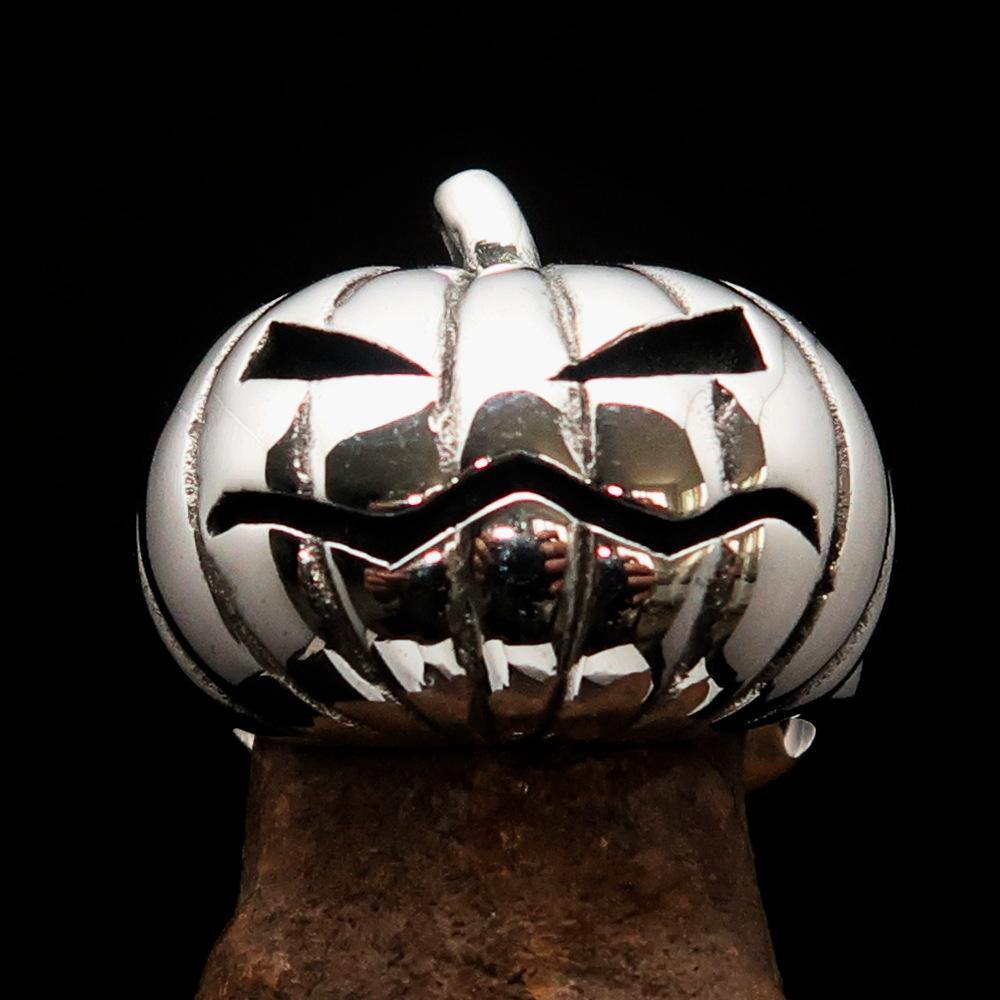 A beautifully crafted sterling silver pumpkin ring for men, featuring an antiqued and high polished finish, showcasing its unique design.