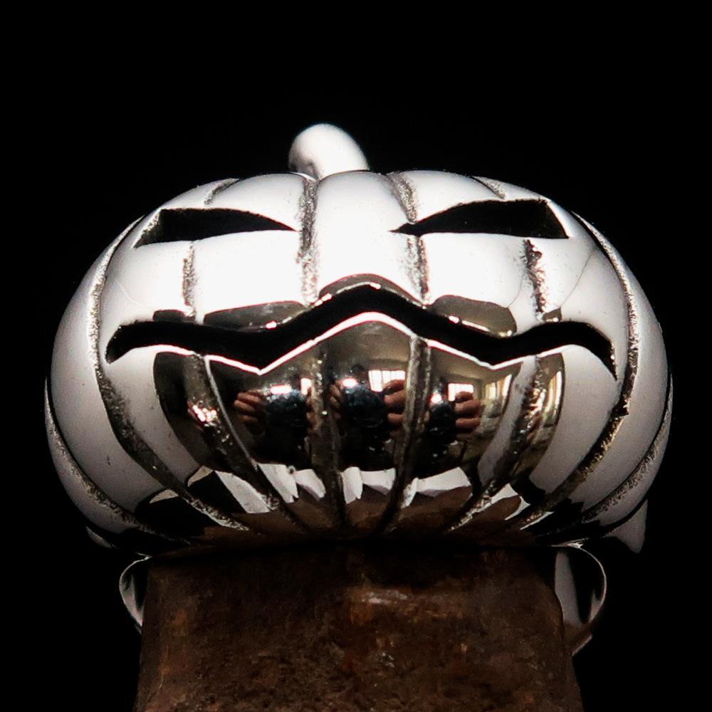 A beautifully crafted sterling silver pumpkin ring for men, featuring an antiqued and high polished finish, showcasing its unique design.