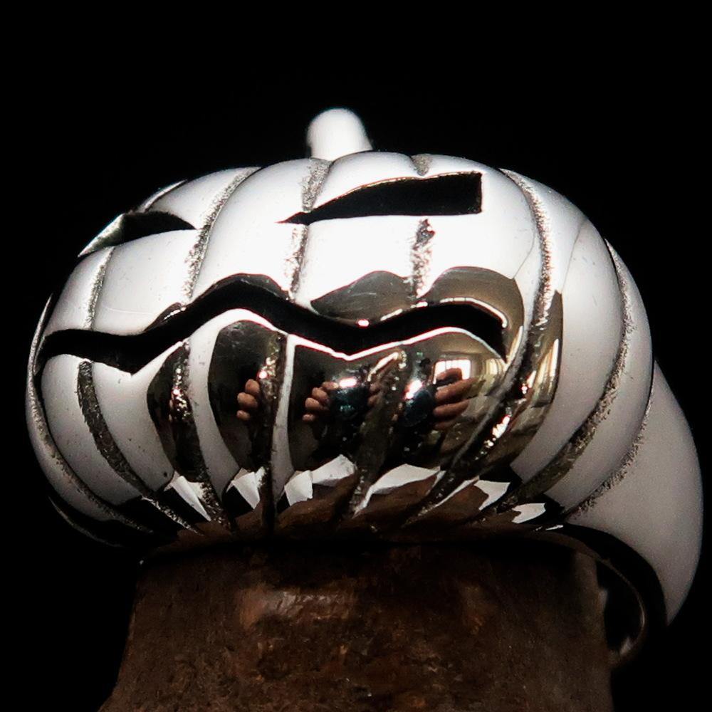 A beautifully crafted sterling silver pumpkin ring for men, featuring an antiqued and high polished finish, showcasing its unique design.