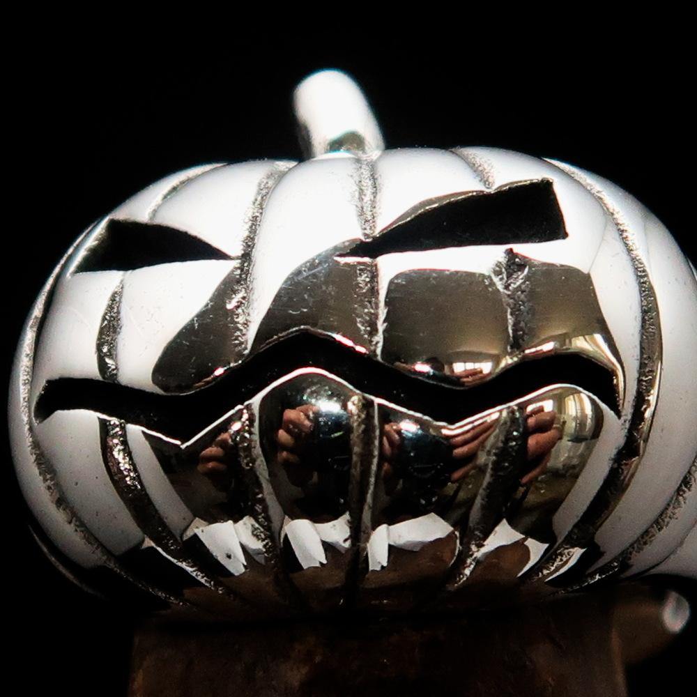 A beautifully crafted sterling silver pumpkin ring for men, featuring an antiqued and high polished finish, showcasing its unique design.