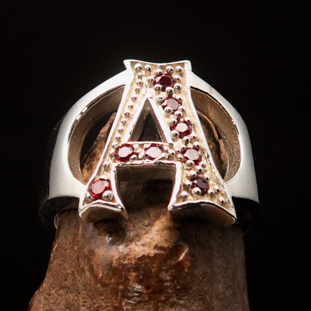 Excellent crafted Initial Ring featuring a bold letter A with 8 red Cubic Zirconias, made from solid Sterling Silver with a polished finish.