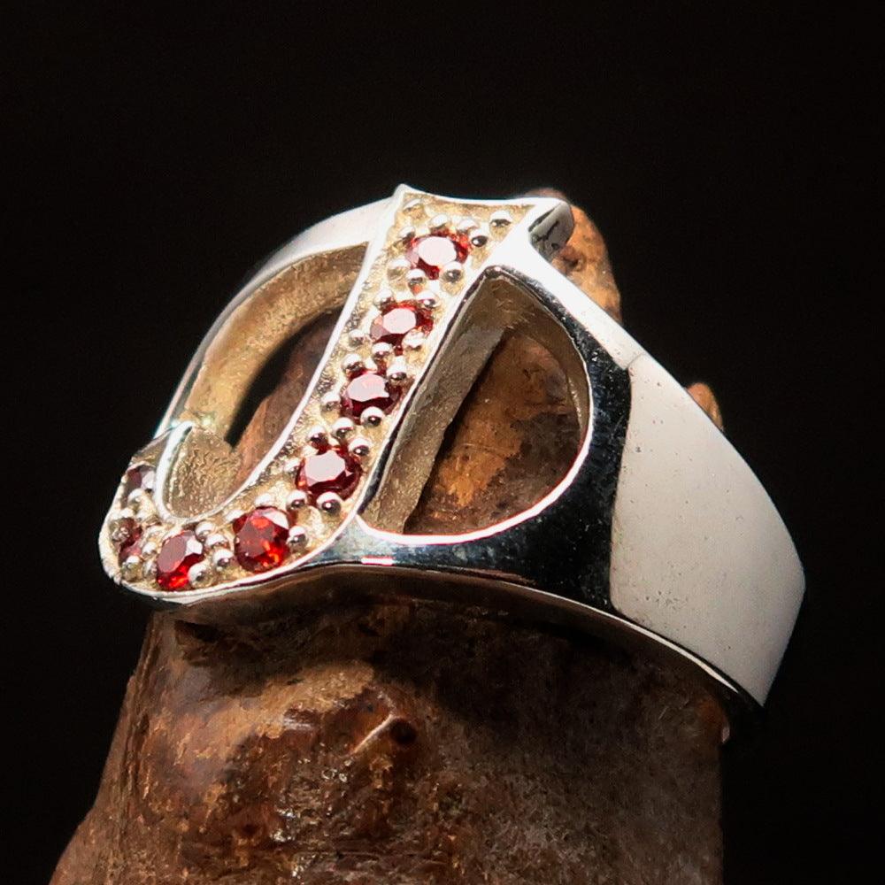 Bold Initial Ring featuring letter J, crafted from sterling silver with 8 red cubic zirconias, showcasing a high polish finish.