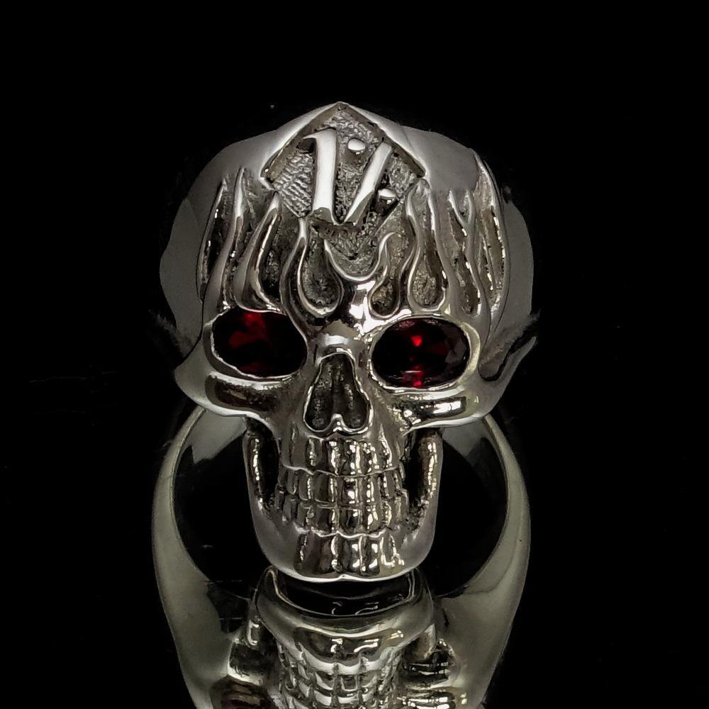 Men's 1% Flaming Skull Outlaw Ring made of solid sterling silver with red cubic zirconia eyes, showcasing a polished finish and detailed skull design.