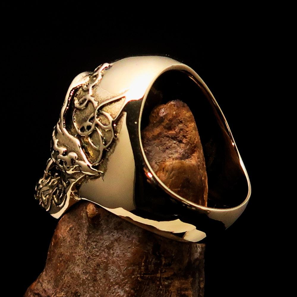 Men's 1% Runes Skull Outlaw Biker Ring made of solid brass with an antiqued finish, showcasing intricate skull and rune designs.