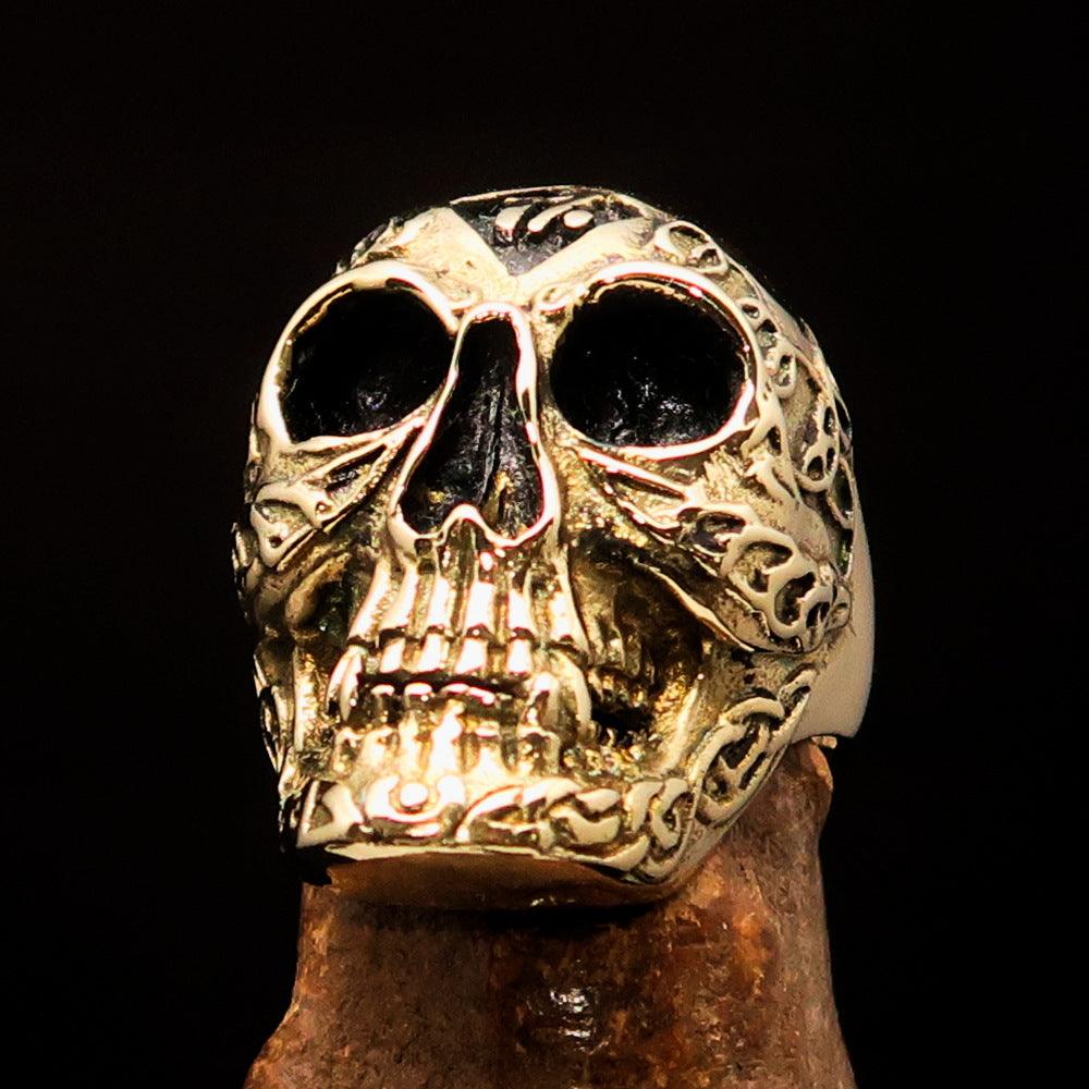 Men's 1% Runes Skull Outlaw Biker Ring made of solid brass with an antiqued finish, showcasing intricate skull and rune designs.