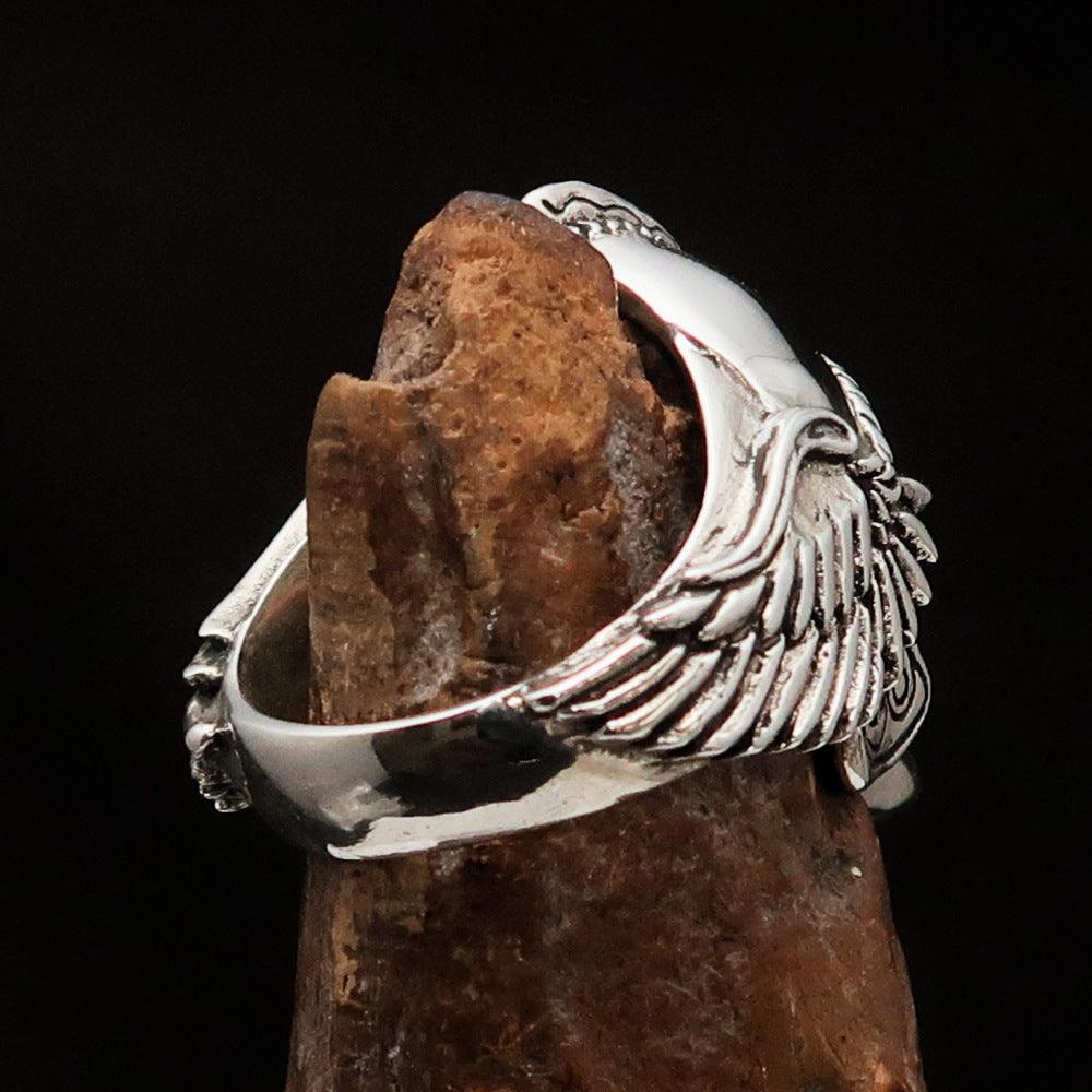 Men's Biker Winged Viking Skull Ring made of solid sterling silver with an antiqued finish, showcasing intricate details and a bold design.