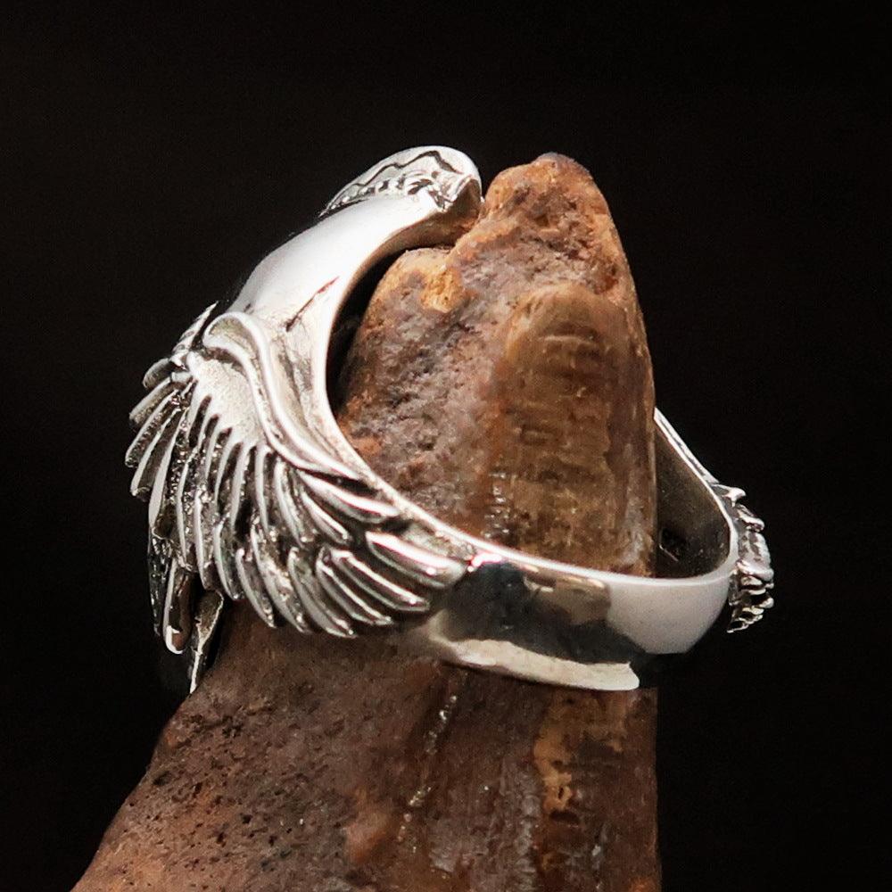 Men's Biker Winged Viking Skull Ring made of solid sterling silver with an antiqued finish, showcasing intricate details and a bold design.