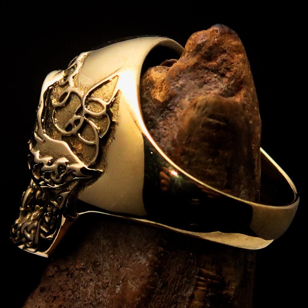 Men's black 1% Runes Skull Outlaw Biker Ring made of solid brass with a mirror polish and black enamel finish, showcasing intricate skull design.