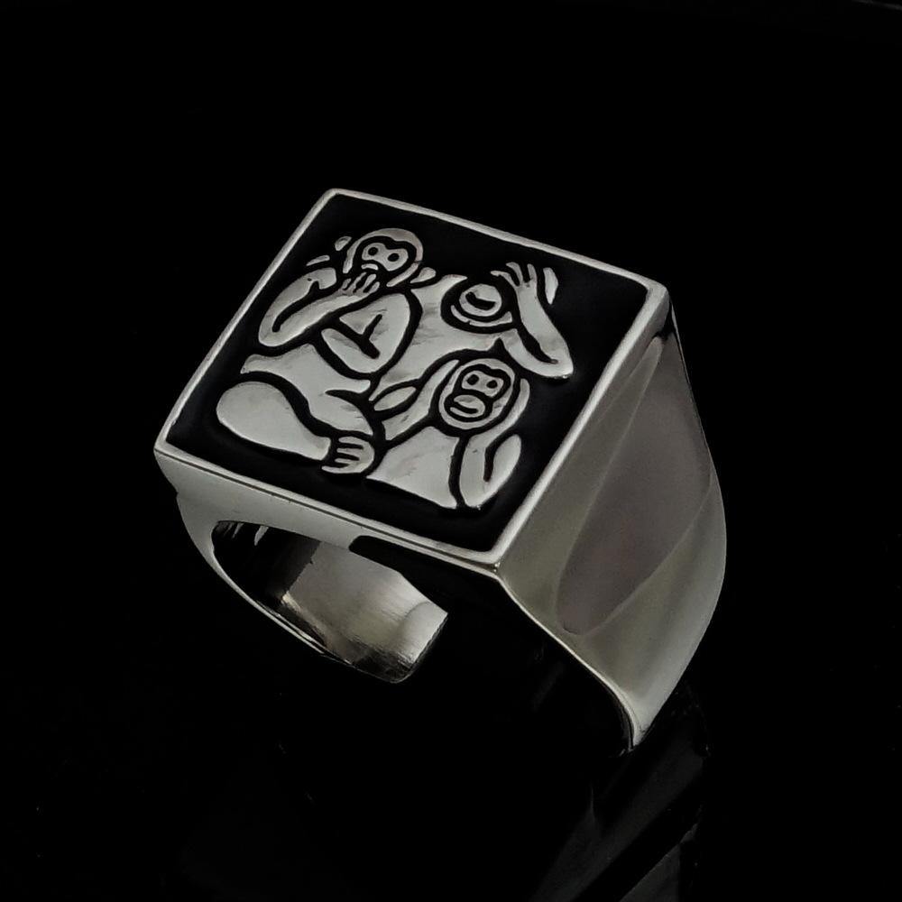 Men's black 3 Monkeys Ring made of high-quality sterling silver with a polished finish and black enamel detailing.