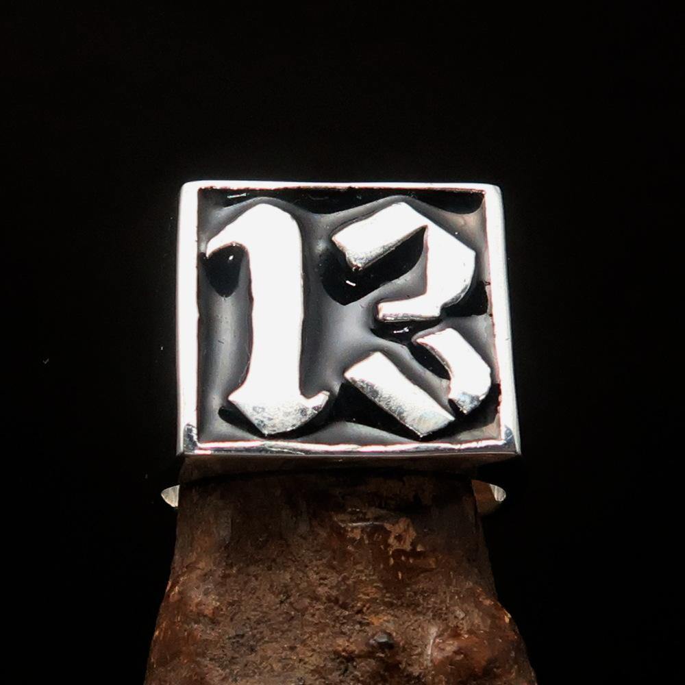 Men's black lucky number 13 ring made of sterling silver with a polished finish and black enamel inlay.