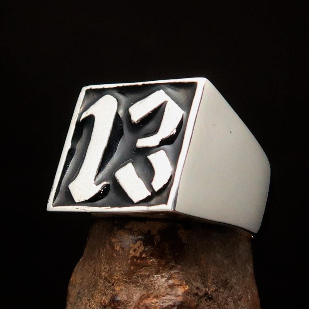 Men's black lucky number 13 ring made of sterling silver with a polished finish and black enamel inlay.