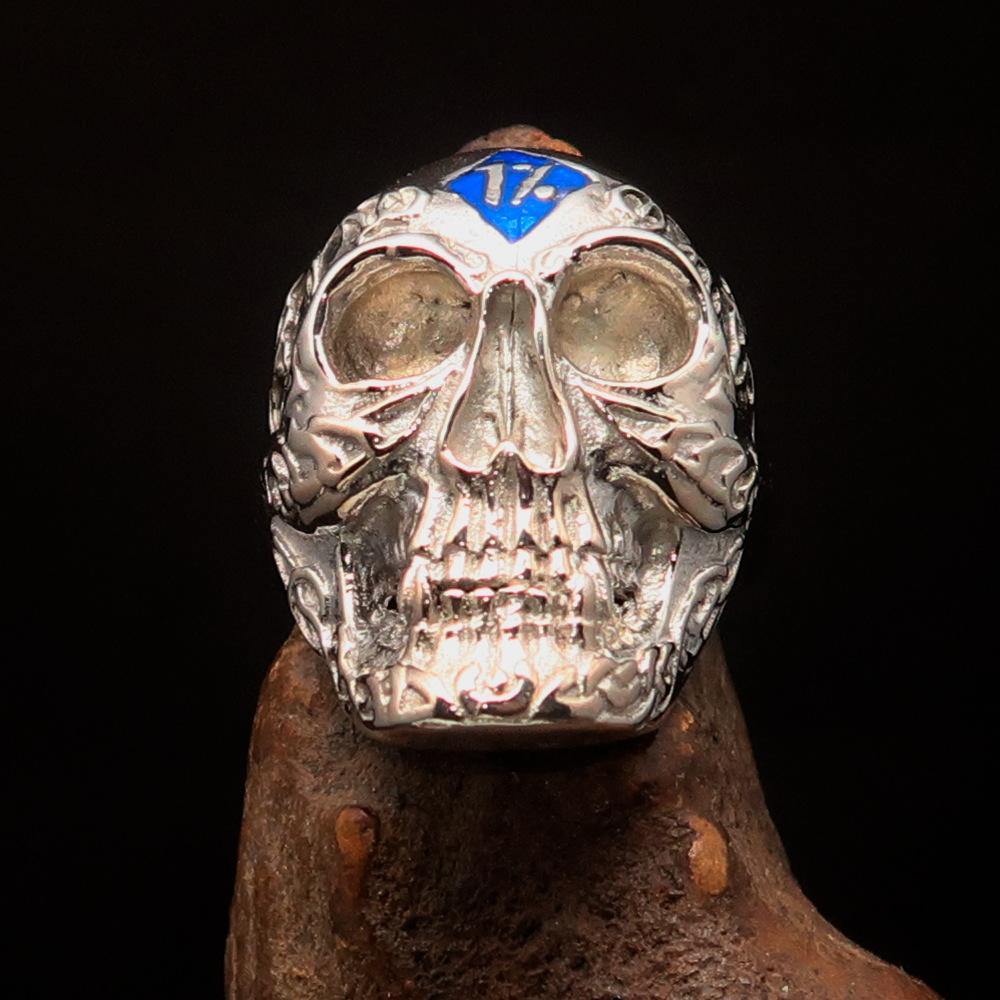 Men's blue 1% Runes Skull Outlaw Ring made of sterling silver with intricate detailing and blue enamel accents.