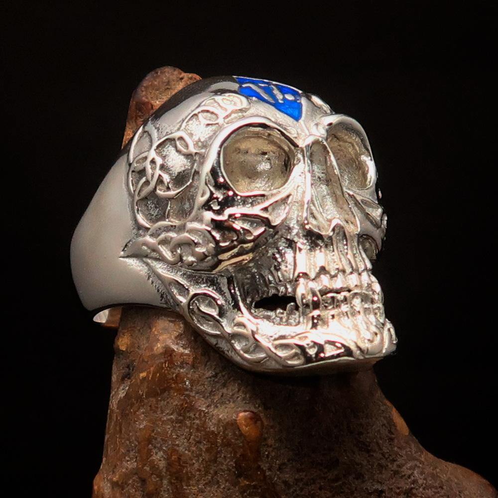 Men's blue 1% Runes Skull Outlaw Ring made of sterling silver with intricate detailing and blue enamel accents.