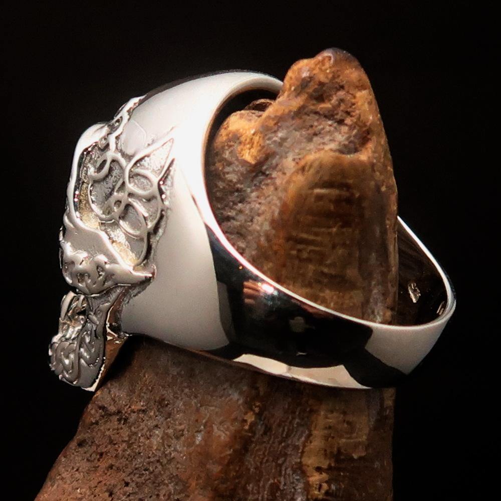 Men's blue 1% Runes Skull Outlaw Ring made of sterling silver with intricate detailing and blue enamel accents.