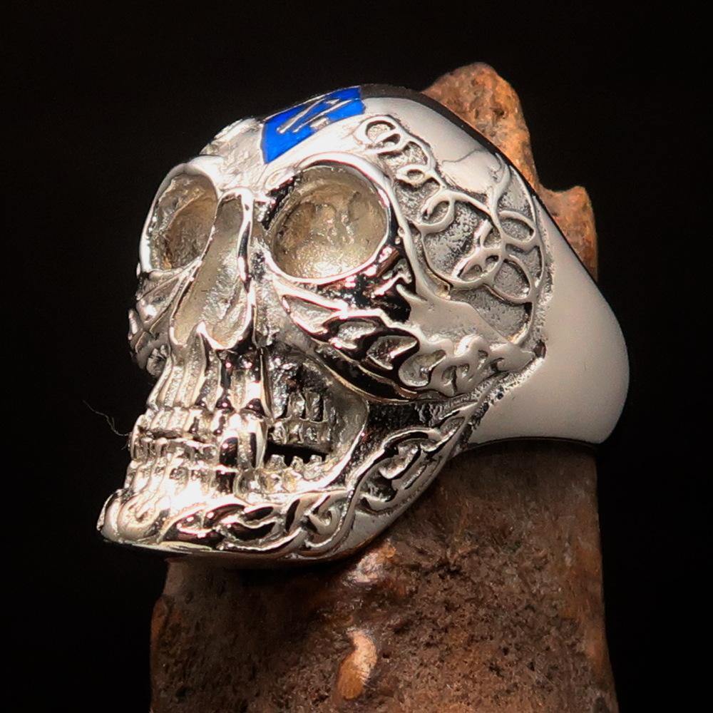 Men's blue 1% Runes Skull Outlaw Ring made of sterling silver with intricate detailing and blue enamel accents.