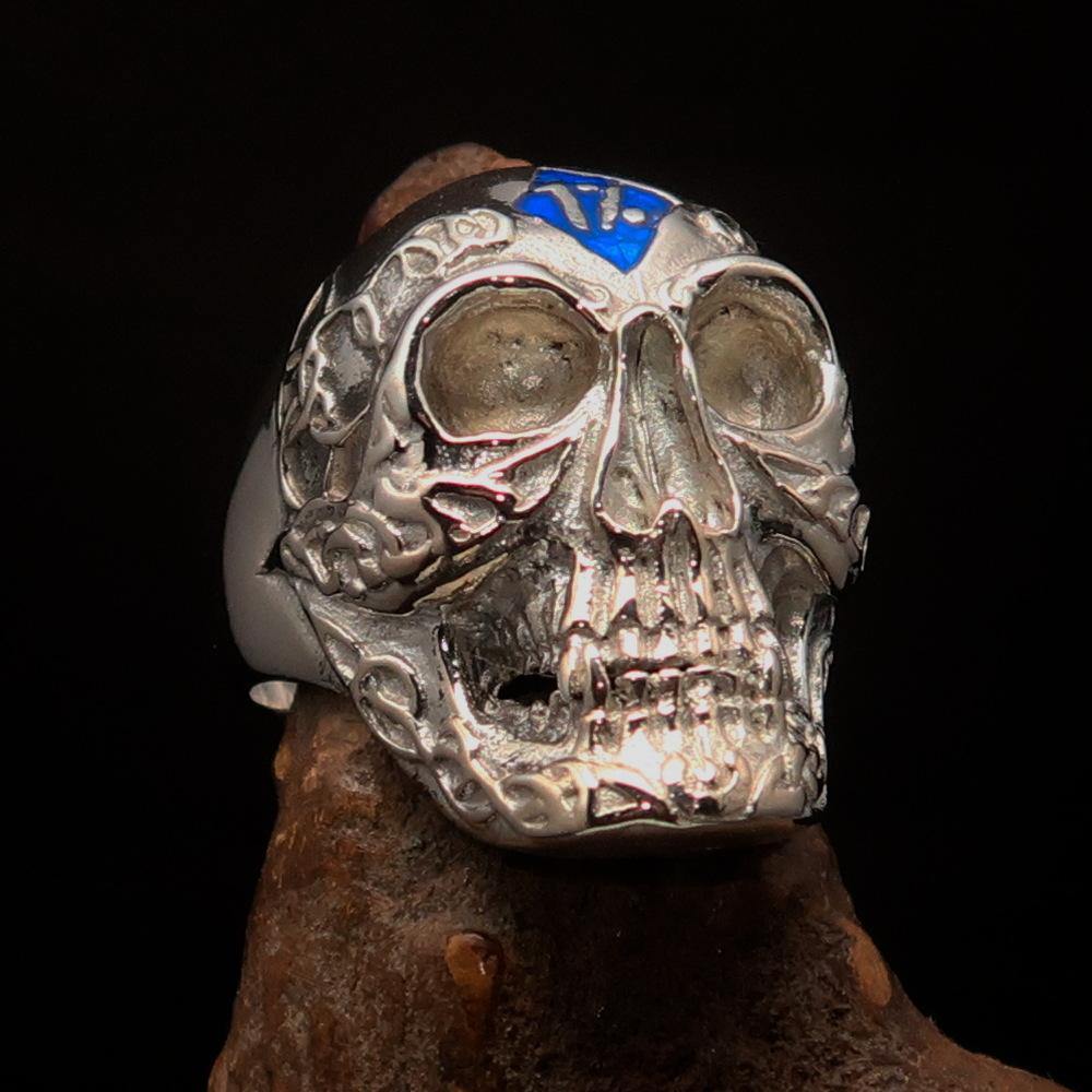 Men's blue 1% Runes Skull Outlaw Ring made of sterling silver with intricate detailing and blue enamel accents.