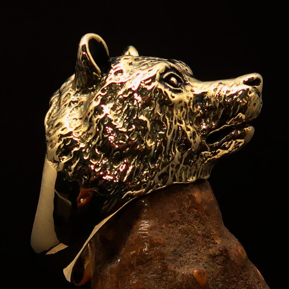 Men's brass animal ranger ring featuring a detailed grizzly bear design, showcasing a high polished and antiqued finish.