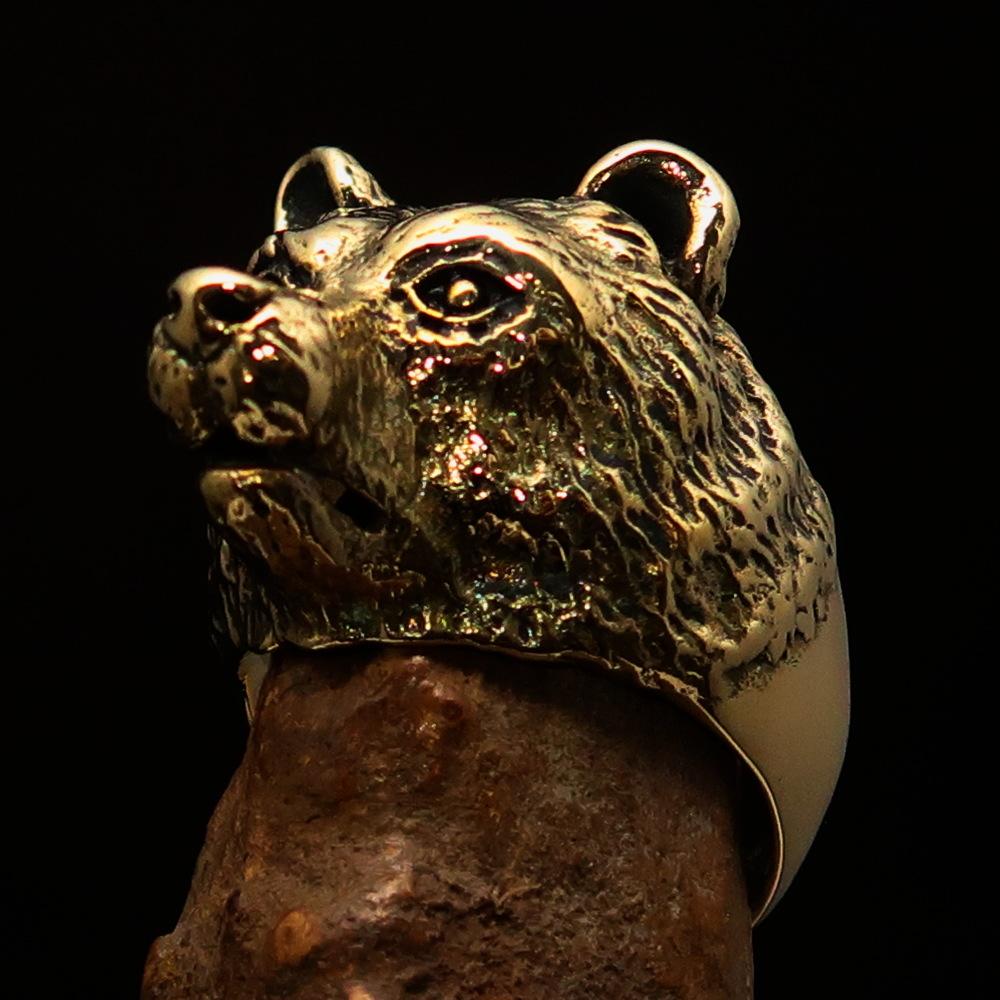 Men's brass animal ranger ring featuring a detailed grizzly bear design, showcasing a high polished and antiqued finish.