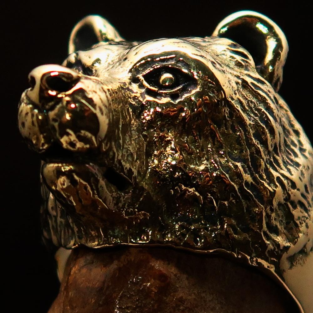 Men's brass animal ranger ring featuring a detailed grizzly bear design, showcasing a high polished and antiqued finish.