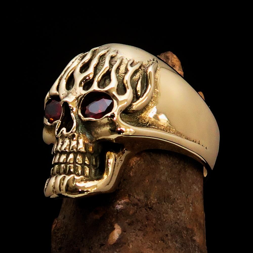 Men's Brass Biker Ring featuring a flaming skull design with red cubic zirconia, showcasing intricate details and a high polish finish.