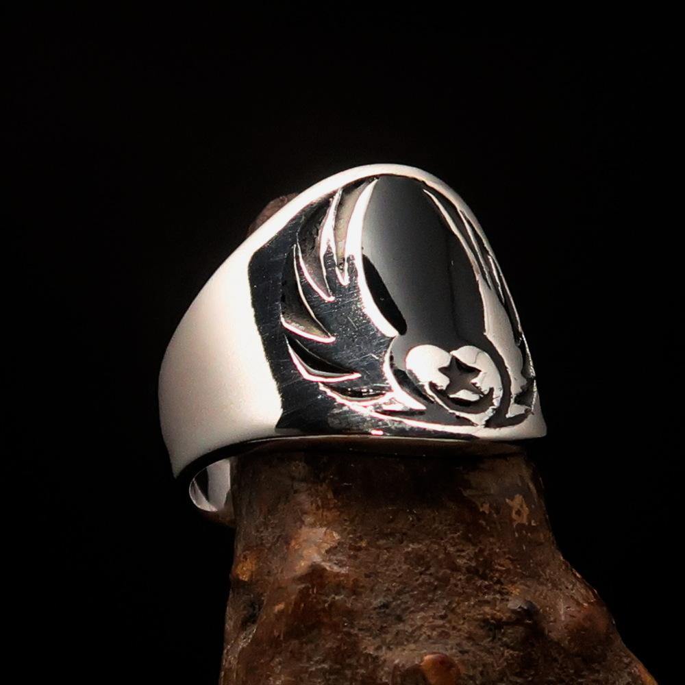 Men's Claddagh Ring featuring a black winged heart design, crafted from solid sterling silver with a high polished finish and enamel accents.