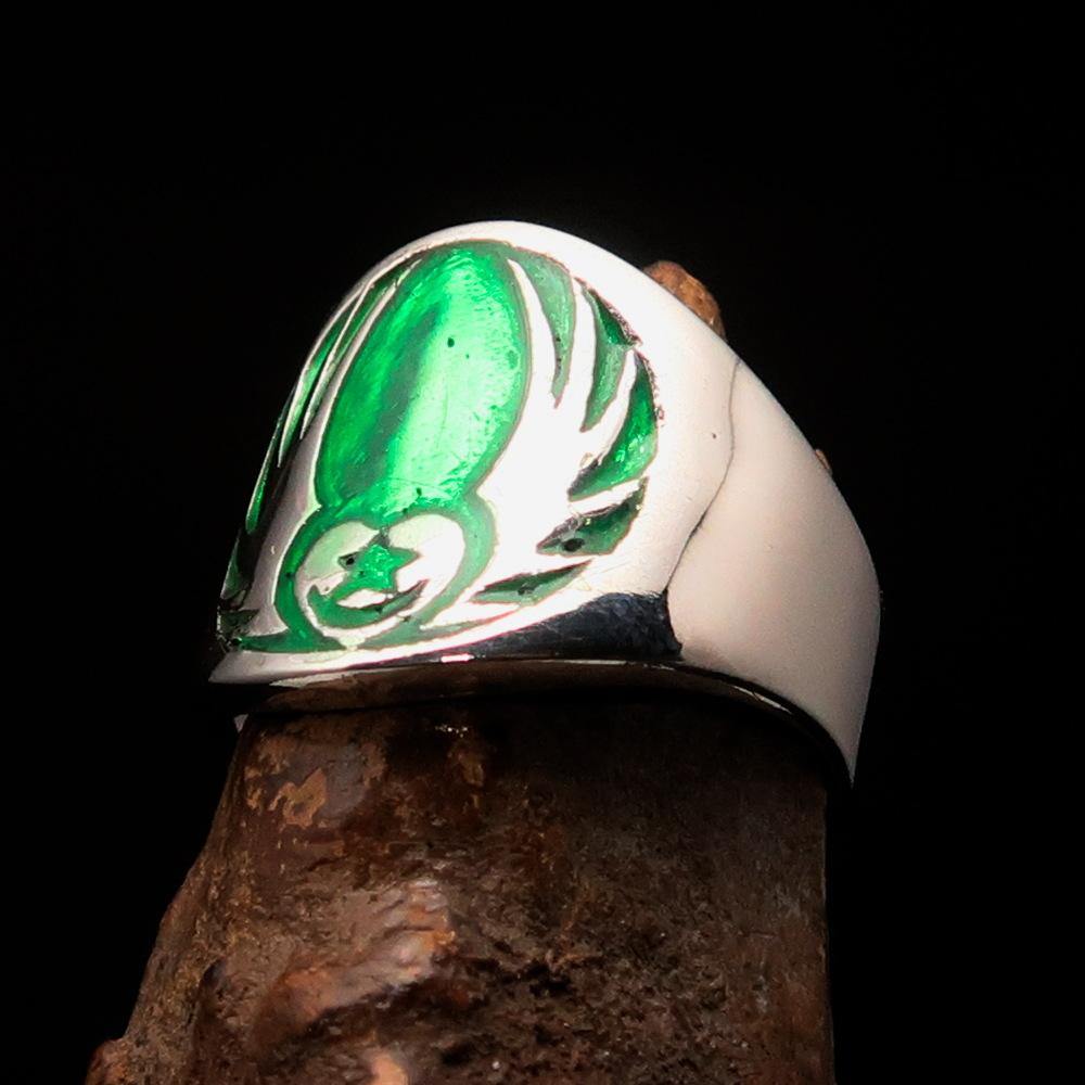 Men's Claddagh Ring in solid sterling silver with a green winged heart design, polished finish, and enamel accents.