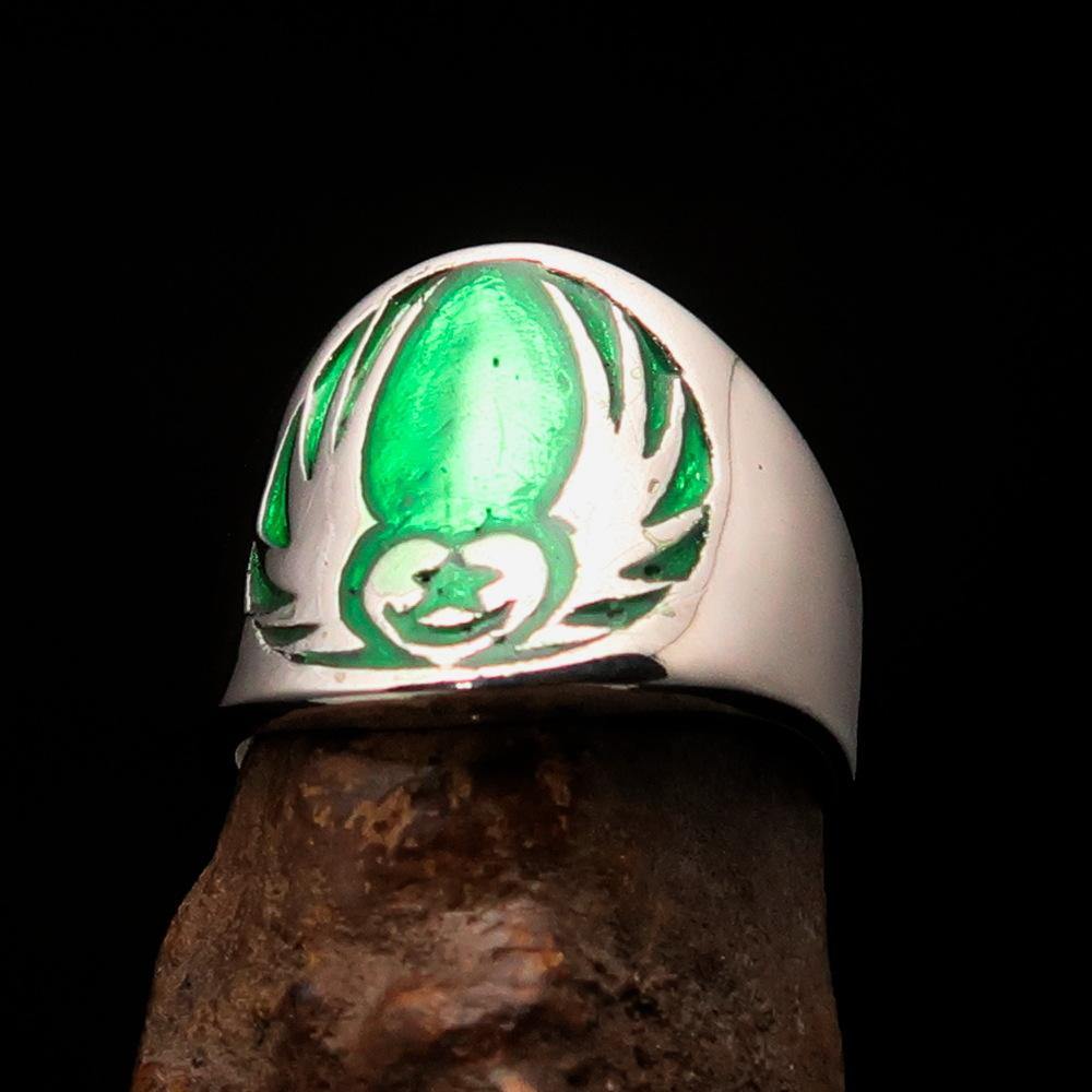 Men's Claddagh Ring in solid sterling silver with a green winged heart design, polished finish, and enamel accents.