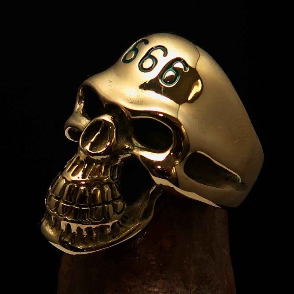 Men's Devil Skull Ring made of solid brass with a high-polished finish and green enamel 666 design on the forehead.