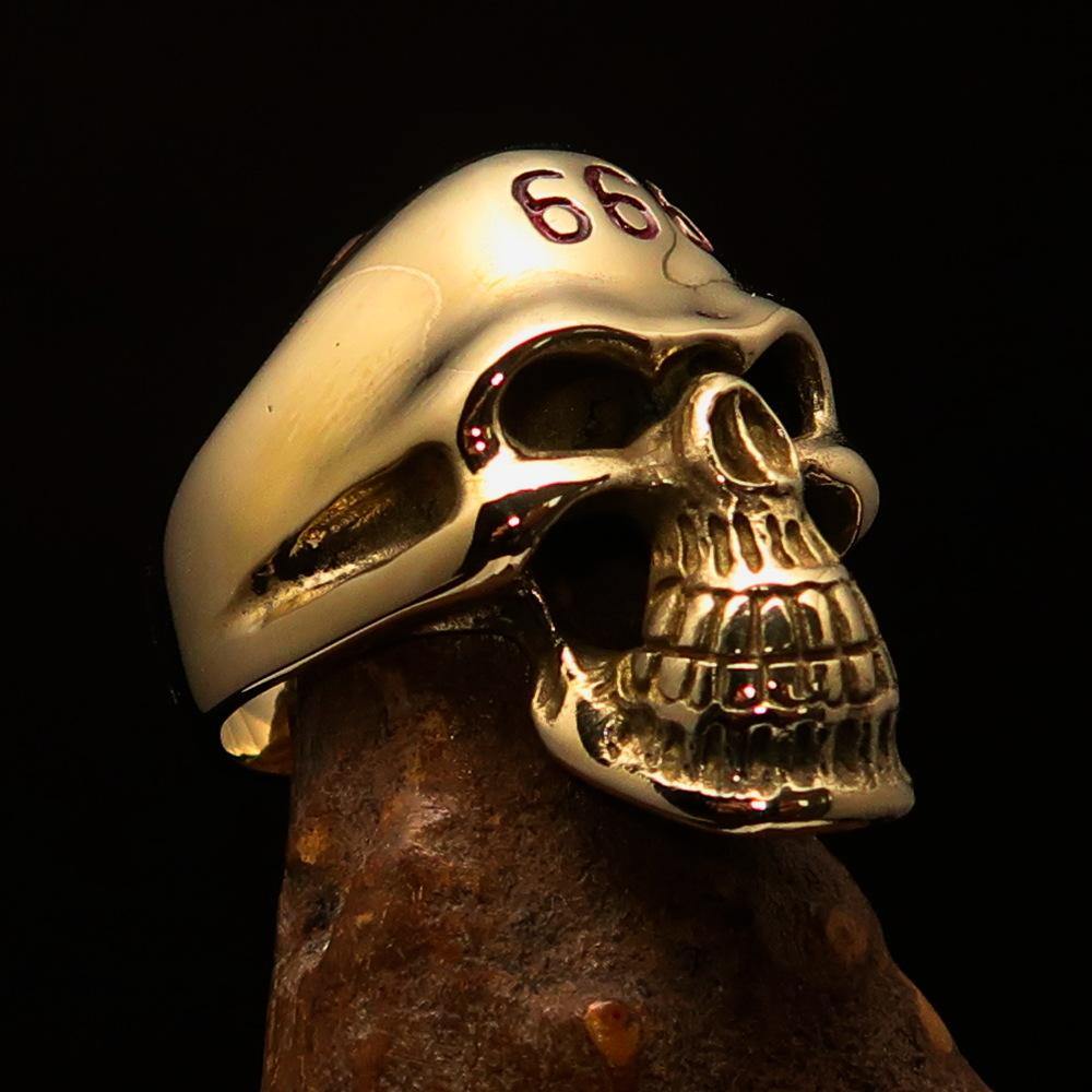 Men's Devil Skull Ring made of solid brass with red enamel 666 design on forehead, showcasing intricate detailing and polished finish.