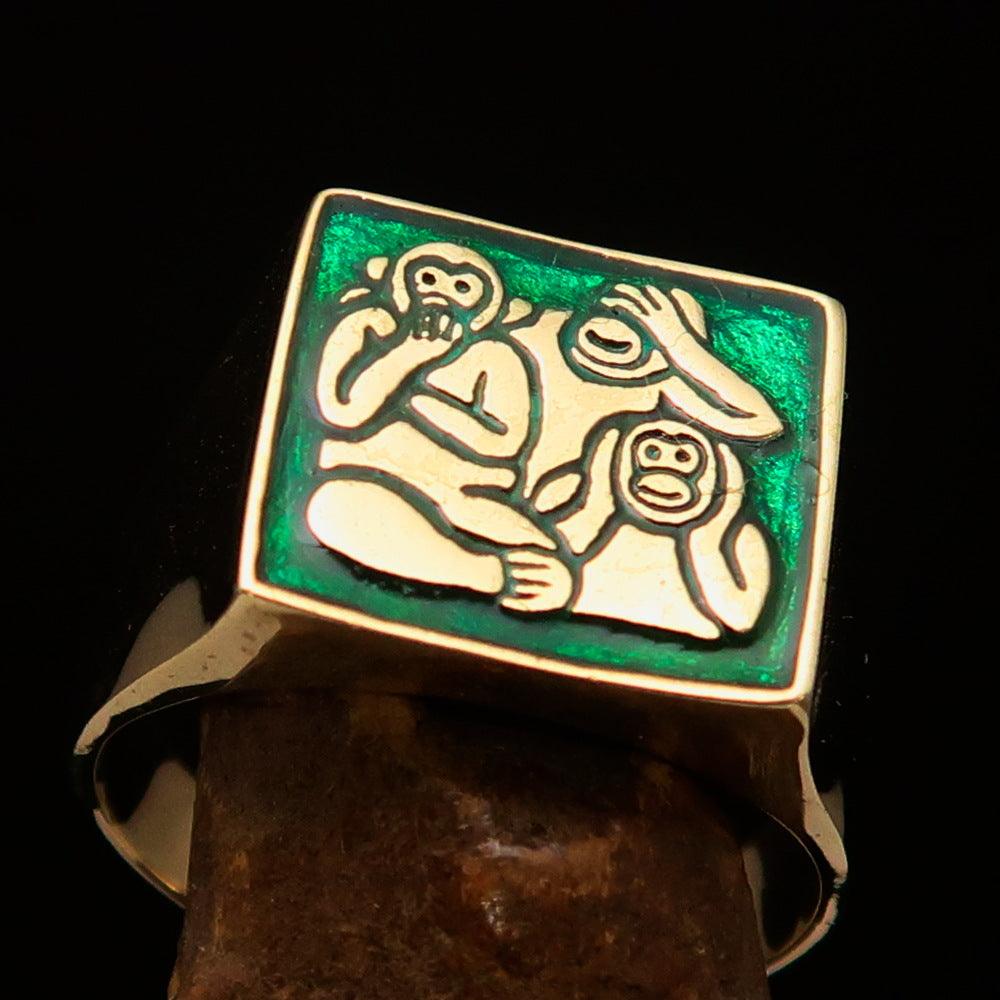 Men's green 3 Monkeys Pinky Ring made of solid brass with vibrant green enamel, featuring intricate monkey designs.