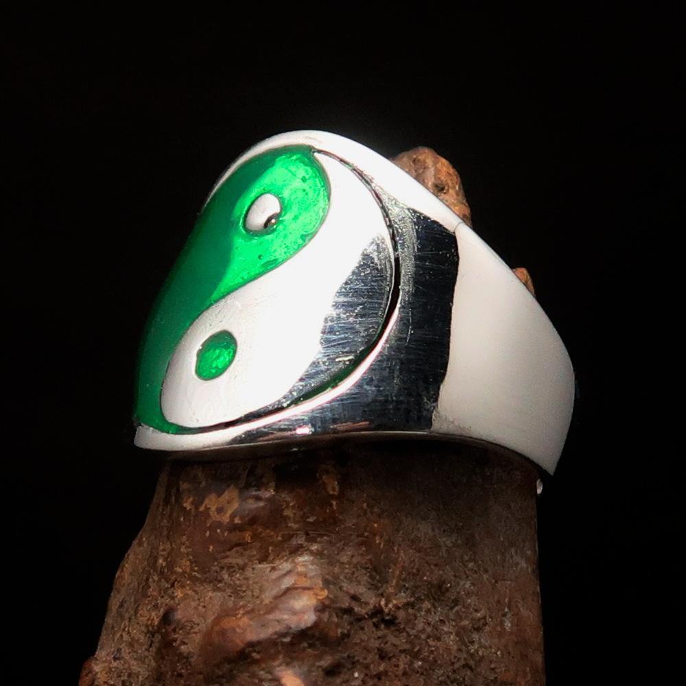 Men's sterling silver Yin Yang ring with green enamel, showcasing a polished finish and intricate design.