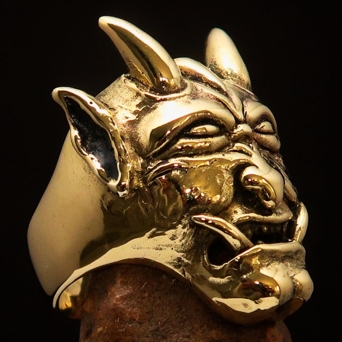 Men's horned Devil Ring made of solid antiqued brass, showcasing intricate details and a polished finish.