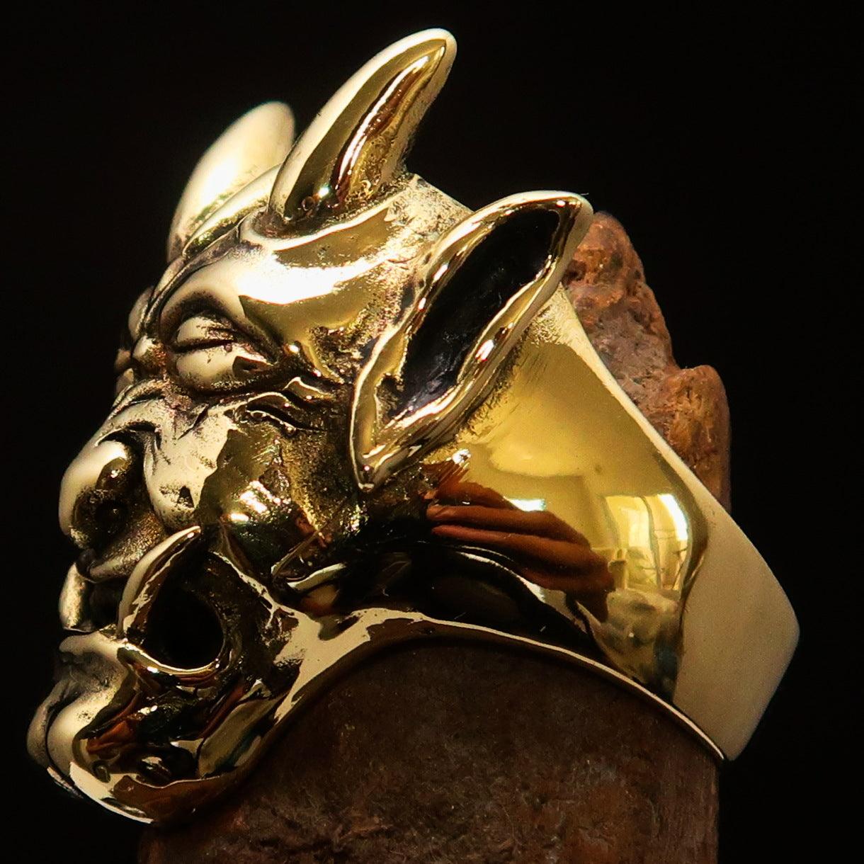 Men's horned Devil Ring made of solid antiqued brass, showcasing intricate details and a polished finish.