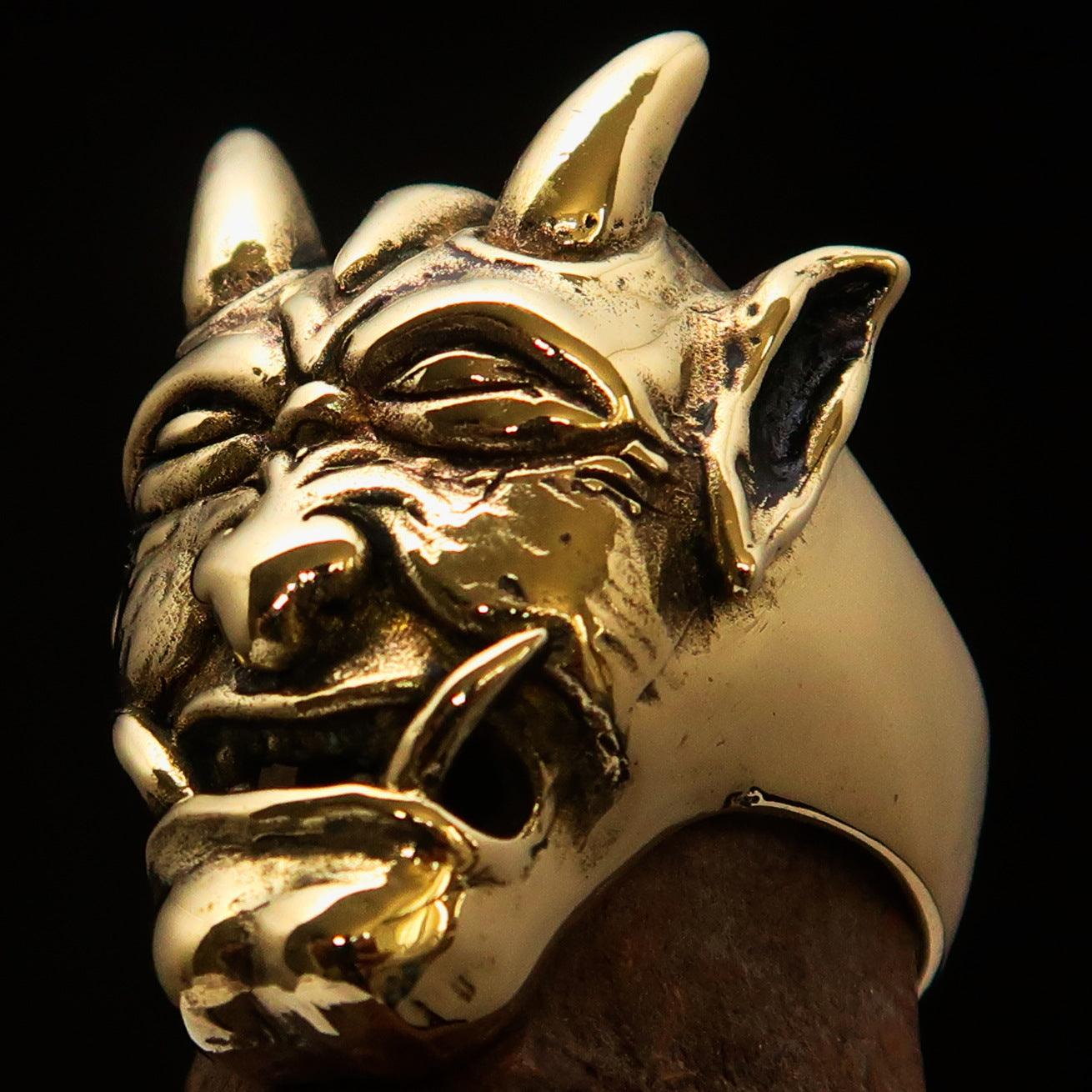 Men's horned Devil Ring made of solid antiqued brass, showcasing intricate details and a polished finish.