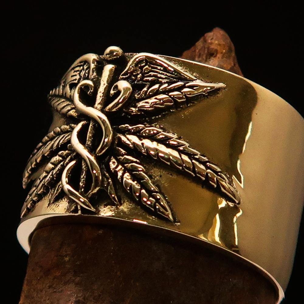 Men's Medical Weed Ring made of solid brass featuring a detailed marihuana leaf design, polished and antiqued for a stylish look.