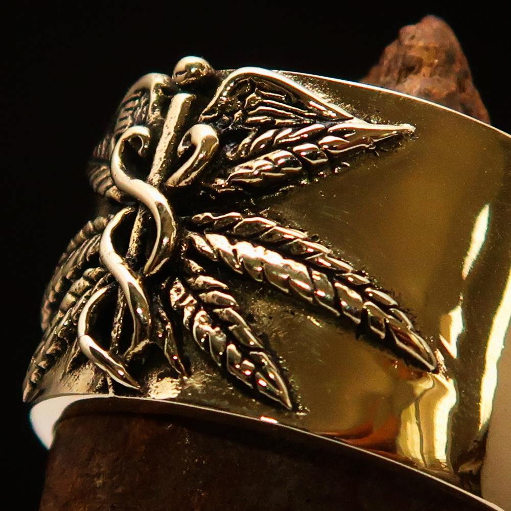 Men's Medical Weed Ring made of solid brass featuring a detailed marihuana leaf design, polished and antiqued for a stylish look.