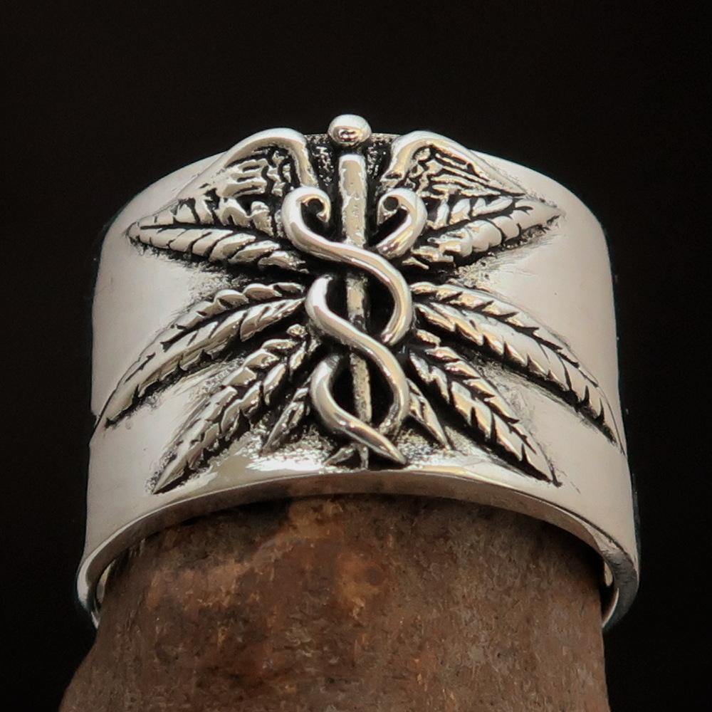 Men's Medical Weed Ring made of solid sterling silver featuring a detailed marijuana leaf design, polished and antiqued finish.