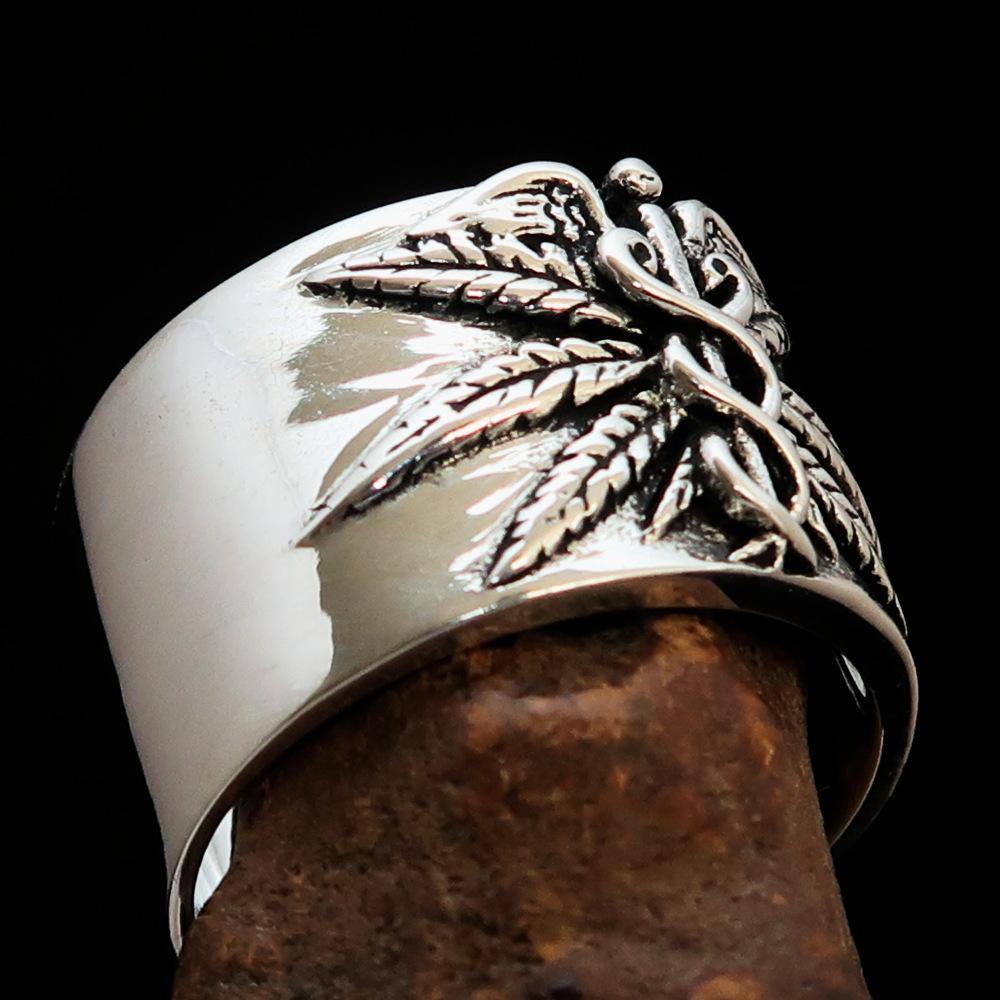 Men's Medical Weed Ring made of solid sterling silver featuring a detailed marijuana leaf design, polished and antiqued finish.