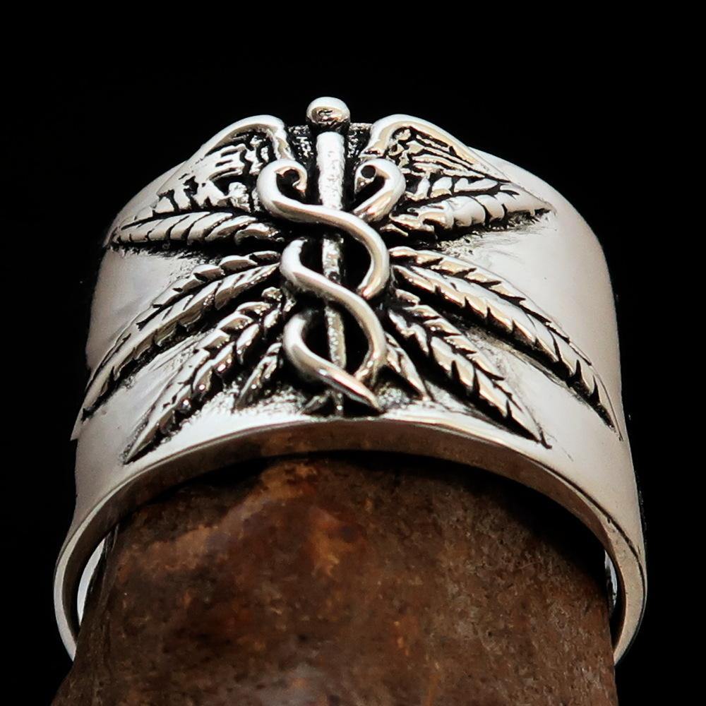 Men's Medical Weed Ring made of solid sterling silver featuring a detailed marijuana leaf design, polished and antiqued finish.