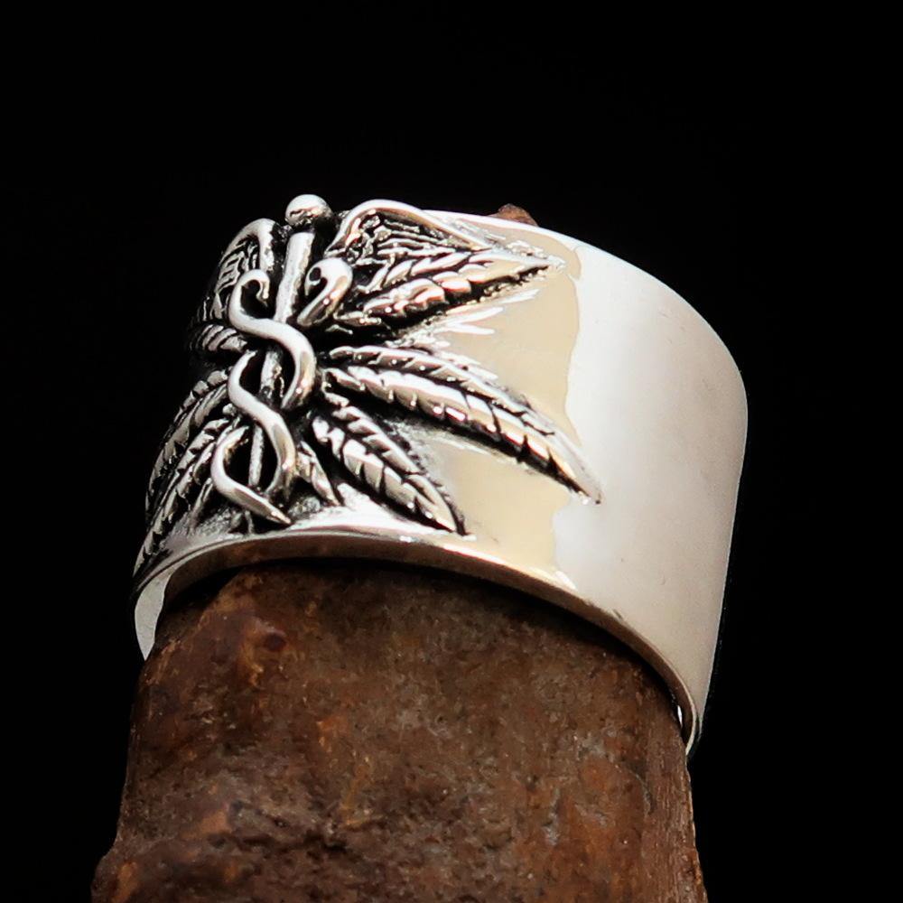 Men's Medical Weed Ring made of solid sterling silver featuring a detailed marijuana leaf design, polished and antiqued finish.