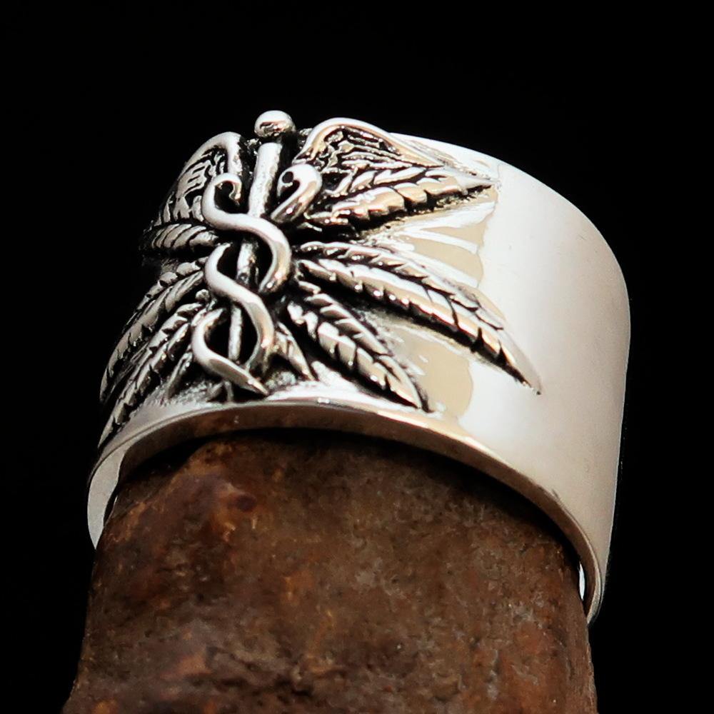 Men's Medical Weed Ring made of solid sterling silver featuring a detailed marijuana leaf design, polished and antiqued finish.