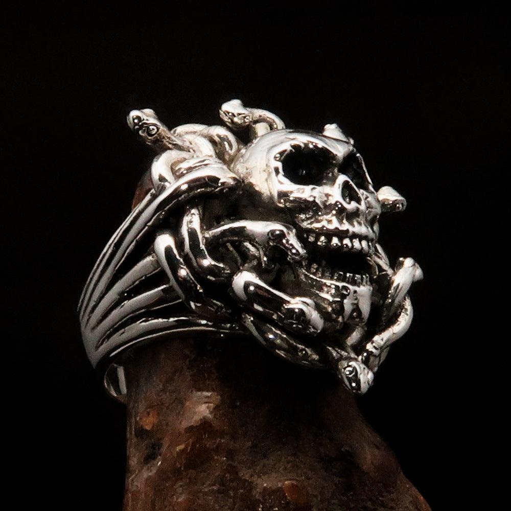 Men's Medusa Head Skull Ring made of antiqued sterling silver, featuring intricate snake designs and a polished finish.