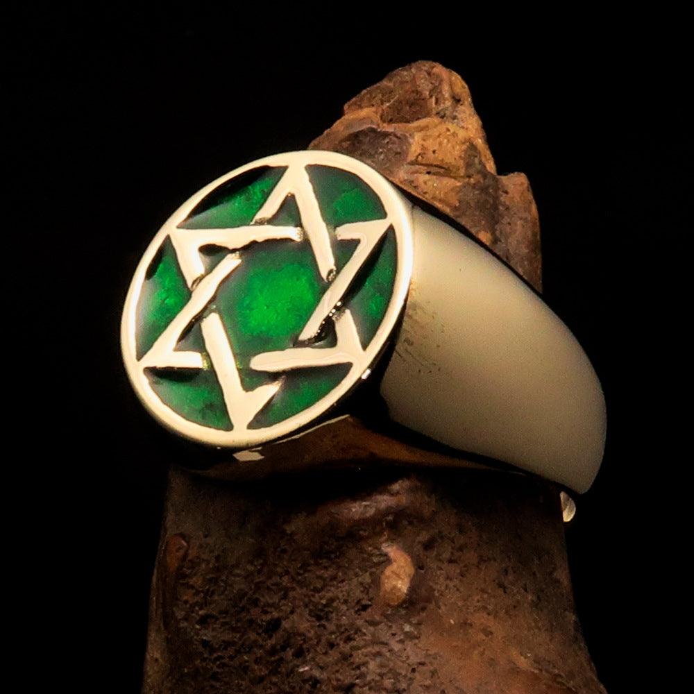 Men's pinky ring made of solid brass featuring a green Star of David, high polished with enamel, showcasing a solid back.