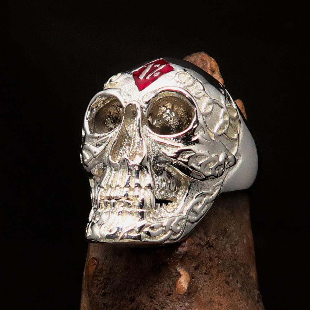 Men's red 1% Runes Skull Outlaw Ring made of solid sterling silver with red enamel detailing, showcasing a polished finish.