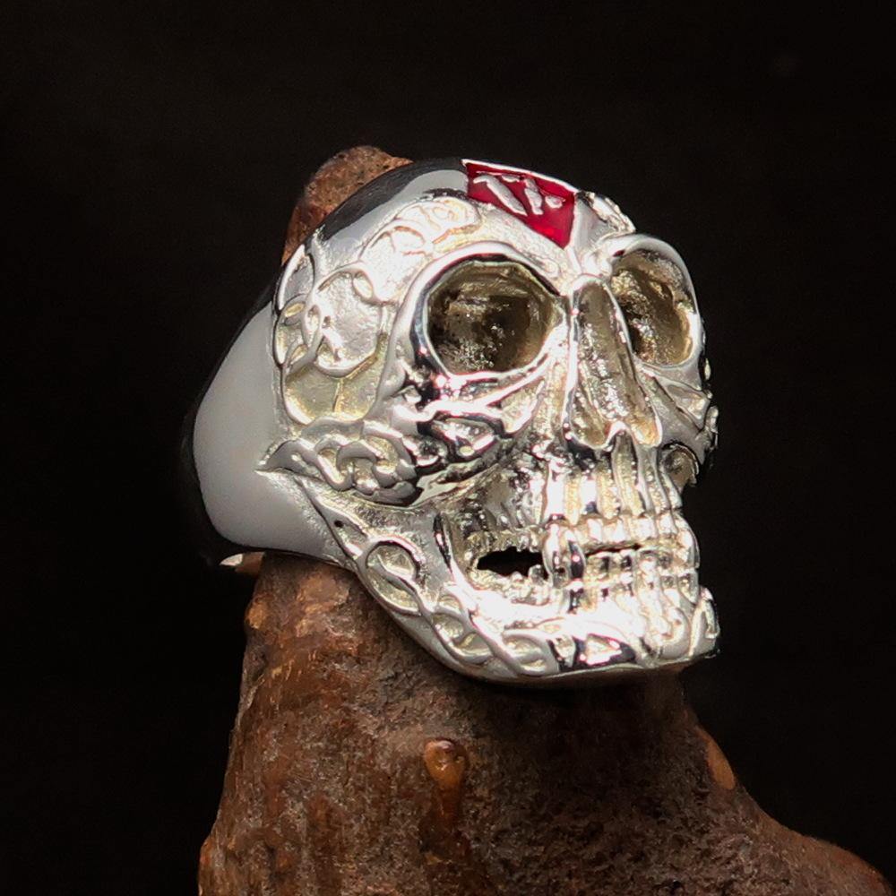 Men's red 1% Runes Skull Outlaw Ring made of solid sterling silver with red enamel detailing, showcasing a polished finish.