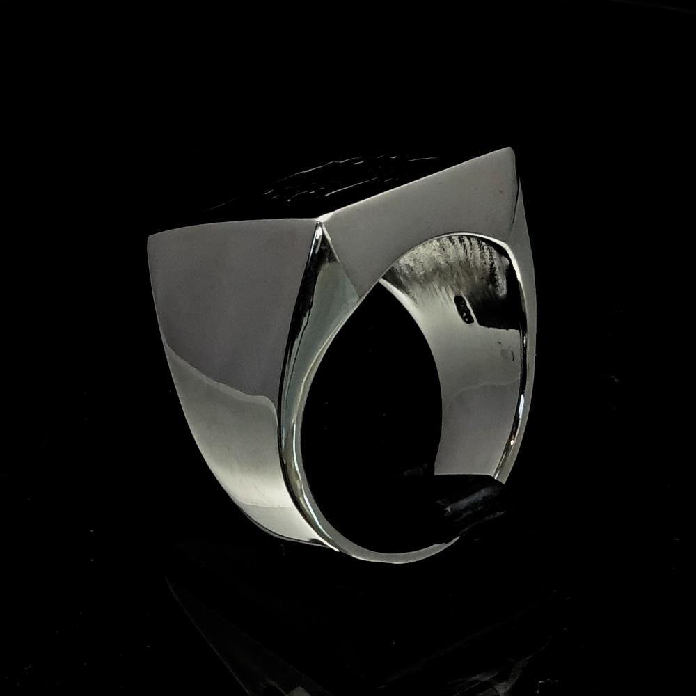 Men's Revolution Ring Black Socialist made of solid sterling silver with a high polish finish and black enamel detailing.