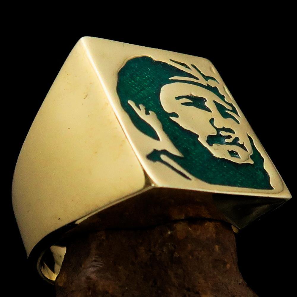 Men's Revolution Ring Green Fidel made of solid brass with high polish and green enamel finish, showcasing its elegant design.