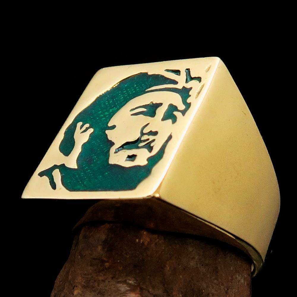 Men's Revolution Ring Green Fidel made of solid brass with high polish and green enamel finish, showcasing its elegant design.